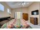 Large main bedroom offering neutral walls, a ceiling fan and access to the bathroom at 5805 Hannah Brook St, North Las Vegas, NV 89081