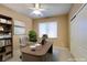 Cozy office with a large wooden desk, ample storage space, and a ceiling fan at 5805 Hannah Brook St, North Las Vegas, NV 89081