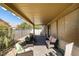 Inviting covered patio featuring stylish furniture and a serene outdoor living space at 5805 Hannah Brook St, North Las Vegas, NV 89081