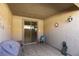 Cozy outdoor patio space with tile flooring, stylish decor, and sliding glass doors at 5805 Hannah Brook St, North Las Vegas, NV 89081