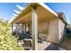 Relaxing covered patio area with brick flooring, ideal for entertaining or enjoying quiet moments outdoors at 5805 Hannah Brook St, North Las Vegas, NV 89081