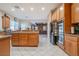 Modern kitchen with stainless steel appliances, granite countertops, and kitchen island at 6632 Blue Hawaii Ave, Las Vegas, NV 89110