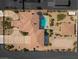Bird's eye view of a large property with a home, pool, guest house, circular driveway, and landscaping at 670 Du Fort Ave, Henderson, NV 89002