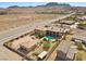 Expansive desert property featuring a large house, detached guest house, and a sparkling backyard pool at 670 Du Fort Ave, Henderson, NV 89002