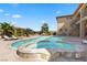 Beautiful backyard pool and spa with stone accents and a spacious patio area for relaxation at 670 Du Fort Ave, Henderson, NV 89002