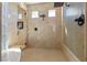 Large walk-in shower boasts dual shower heads, a glass door, and tiled walls for a modern, clean look at 670 Du Fort Ave, Henderson, NV 89002