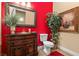 Stylish bathroom with custom vanity, decorative mirror, and ample natural light at 670 Du Fort Ave, Henderson, NV 89002