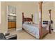Comfortable bedroom with en suite, featuring a four-poster bed and neutral decor at 670 Du Fort Ave, Henderson, NV 89002