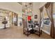 Elegant dining room with a glass-top table, seating for four, and a view of the exterior at 670 Du Fort Ave, Henderson, NV 89002