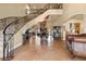 Grand foyer with a sweeping staircase and high ceilings, creating an elegant entryway at 670 Du Fort Ave, Henderson, NV 89002