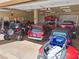Spacious garage featuring multi-vehicle storage and a car lift system at 670 Du Fort Ave, Henderson, NV 89002