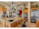 Gourmet kitchen with a large island, granite countertops, stainless steel appliances, and custom cabinetry at 670 Du Fort Ave, Henderson, NV 89002
