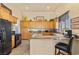 Kitchen featuring granite countertops, black appliances and eat-in bar area at 670 Du Fort Ave, Henderson, NV 89002