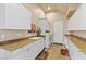 Bright laundry room with granite countertops and ample storage space at 670 Du Fort Ave, Henderson, NV 89002