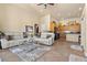 Open concept living room with breakfast bar, couches, and access to other rooms in the house at 670 Du Fort Ave, Henderson, NV 89002
