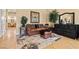 Comfortable sitting room with stylish decor and plush leather furniture, providing a relaxing and inviting space at 670 Du Fort Ave, Henderson, NV 89002