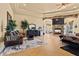 Cozy sitting room with a stone fireplace, plush seating, and tasteful decor creating a welcoming atmosphere at 670 Du Fort Ave, Henderson, NV 89002