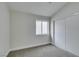 Neutral bedroom featuring plush carpet, closet, and natural light at 71 Sea Holly Way, Henderson, NV 89074