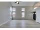 Bright living room featuring vaulted ceilings, modern light wood floors and oversized windows at 71 Sea Holly Way, Henderson, NV 89074