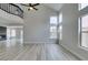 Living area with a staircase and an upper-level balcony at 71 Sea Holly Way, Henderson, NV 89074