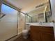 Bathroom with shower/tub combo and vanity at 7588 Kalmalii Ave, Las Vegas, NV 89147