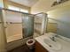Bathroom with shower/tub combo, toilet, and vanity at 7588 Kalmalii Ave, Las Vegas, NV 89147