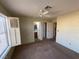 Bright bedroom with ceiling fan and window shutters at 7588 Kalmalii Ave, Las Vegas, NV 89147