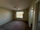 Bedroom with ceiling fan and window shutters at 7588 Kalmalii Ave, Las Vegas, NV 89147
