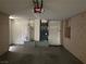 Garage with water heater, AC unit and storage cabinets at 7588 Kalmalii Ave, Las Vegas, NV 89147
