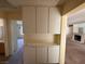 Hallway with built-in cabinets and view into living room at 7588 Kalmalii Ave, Las Vegas, NV 89147