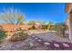 Enjoy a relaxing backyard featuring stone landscaping, seating areas, and a hammock at 7936 Tolberts Mill Dr, Las Vegas, NV 89131