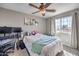This bedroom features a ceiling fan and natural light from the window at 7936 Tolberts Mill Dr, Las Vegas, NV 89131