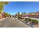 Gated community entrance with manicured landscaping offers security and curb appeal at 7936 Tolberts Mill Dr, Las Vegas, NV 89131