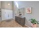Bright entryway features tiled floors, modern decor, and a statement mirror at 7936 Tolberts Mill Dr, Las Vegas, NV 89131