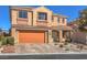 Charming two-story home boasts a two-car garage, neutral stucco, and a well-maintained landscape at 7936 Tolberts Mill Dr, Las Vegas, NV 89131