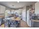 Kitchen with stainless appliances, dual oven and granite counters with an eat-in island at 7936 Tolberts Mill Dr, Las Vegas, NV 89131