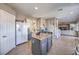 Spacious kitchen with granite counters, an island with seating and stainless steel appliances at 7936 Tolberts Mill Dr, Las Vegas, NV 89131
