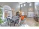 Bright and airy living area featuring a large window and a dining area at 7936 Tolberts Mill Dr, Las Vegas, NV 89131