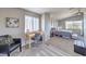 This room offers both a sleeping space and an office area with a window for natural light at 7936 Tolberts Mill Dr, Las Vegas, NV 89131