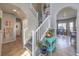 Bright stairway leads to the upper level, with views of the home's open floor plan at 7936 Tolberts Mill Dr, Las Vegas, NV 89131