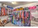 Organized walk-in closet with shelving, racks, and compartments for optimal storage at 7936 Tolberts Mill Dr, Las Vegas, NV 89131