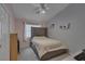 Bright bedroom with a full sized bed and decorative shelves at 830 Roaring Falls Ave, Henderson, NV 89052