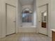 Bright bathroom featuring a soaking tub, tile floors, and a window at 840 Candido Garcia Ave, Henderson, NV 89015