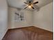Neutral bedroom with a ceiling fan and a large window allowing natural light at 840 Candido Garcia Ave, Henderson, NV 89015