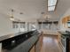 Spacious kitchen featuring a breakfast bar, tile floors, and stainless steel appliances at 840 Candido Garcia Ave, Henderson, NV 89015