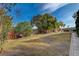 Spacious backyard with large grassy area and mature trees at 8870 S Tenaya Way, Las Vegas, NV 89113