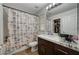 Bathroom with tub, shower, and dark brown vanity at 8870 S Tenaya Way, Las Vegas, NV 89113