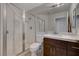 Bathroom with shower, toilet, and vanity with marble countertop at 8870 S Tenaya Way, Las Vegas, NV 89113