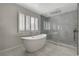 Elegant bathroom featuring a large soaking tub and walk-in shower at 8870 S Tenaya Way, Las Vegas, NV 89113