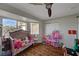 bedroom with pink decor and toys at 8870 S Tenaya Way, Las Vegas, NV 89113